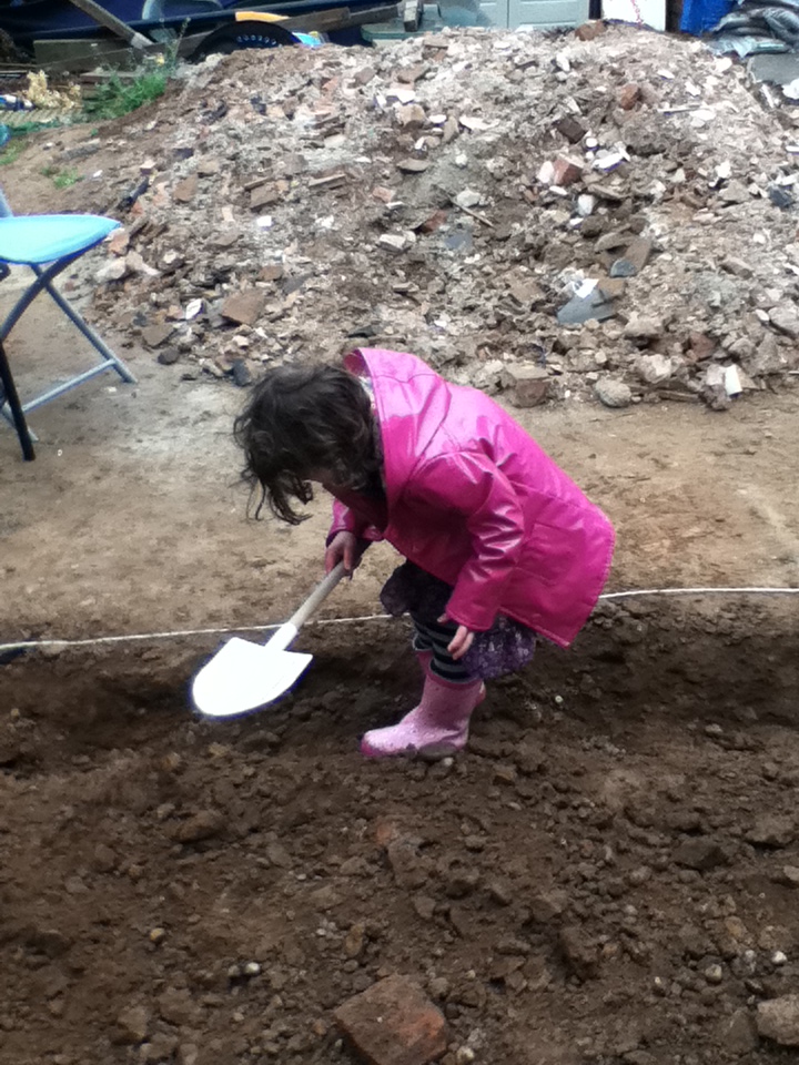 Child digging in the garden