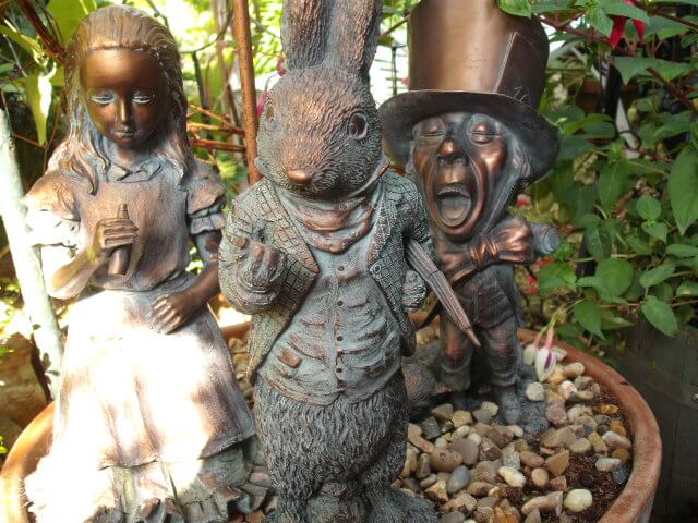 Alice in Wonderland, Mad Hatter, and Rabbit garden statues